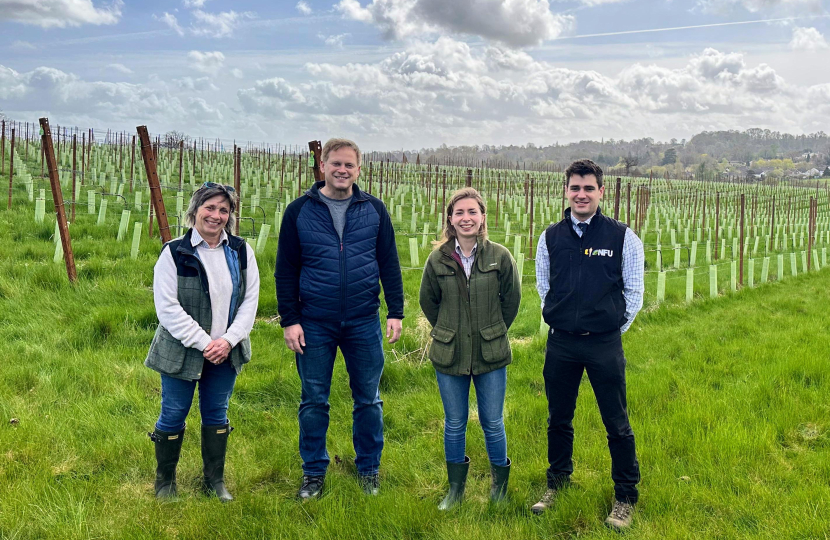 Grant standing with the Buisman family at the vineyard